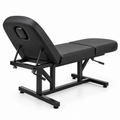 Black 3-section adjustable salon and massage treatment bed with face hole, rear side angle view