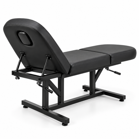 Black 3-section adjustable salon and massage treatment bed with face hole, rear side angle view