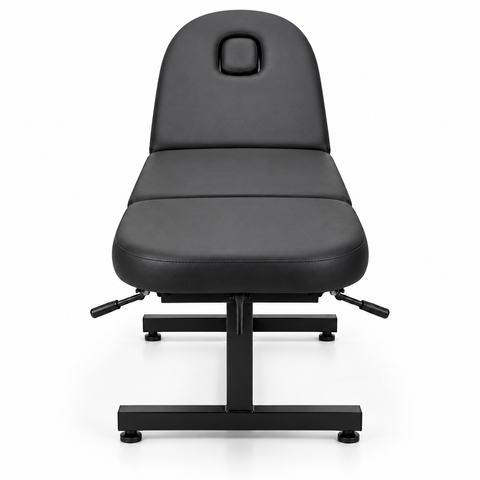 Adjustable black beauty treatment and massage bed with face hole, front view