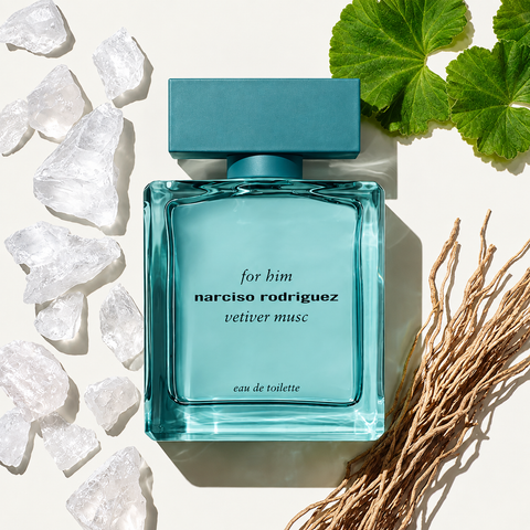Narciso Rodriguez For Him Vetiver Musc Eau de Toilette bottle with vetiver roots and fresh green leaves
